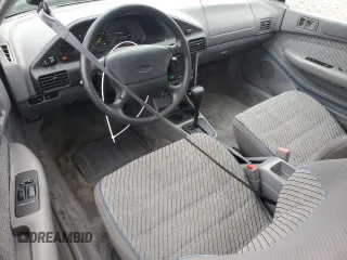 1995 Ford Escort z VIN 1FASP1284SW307142, wystawiony jako Copart lot #88531955 z przebiegiem 93 323 mil mil oraz Szkoda całkowita • Salvage title. Historia ofert i sprzedaży dostępna na DreamBid. Obrazek 8.