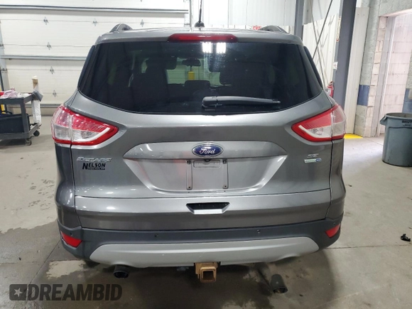 2014 Ford Escape SE with VIN 1FMCU9G96EUE53240, listed as a Copart auction lot 51920455 with 180,948 mi miles and Salvage Title. Bid and sale history available at DreamBid. Image 6.