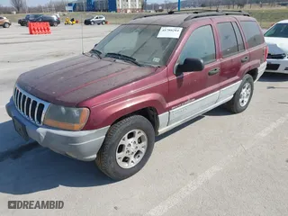 1999 Jeep Grand Cherokee Laredo with VIN 1J4GW58S6XC554582, listed as a IAAI auction lot 41780284 with 183,156 mi miles. Bid and sale history available at carsss.com. Image 2.