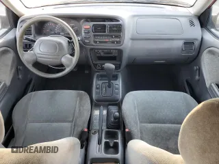 1999 Suzuki Vitara JX z VIN 2S3TD52V6X6101702, wystawiony jako Copart lot #42596125 z przebiegiem 225 614 mil mil oraz Tytuł czysty. Historia ofert i sprzedaży dostępna na DreamBid. Obrazek 8.
