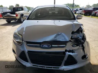 2012 Ford Focus SE with VIN 1FAHP3F29CL161559, listed as a Copart auction lot 61695575 with 127,412 mi miles and Salvage title. Bid and sale history available at DreamBid. Image 5.