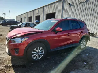 2016 Mazda CX-5 Touring z VIN JM3KE2CY5G0690045, wystawiony jako Copart lot #60691225 z przebiegiem 130 977 mil mil oraz Szkoda całkowita • Salvage title. Historia ofert i sprzedaży dostępna na DreamBid. Obrazek 1.