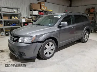 2013 Dodge Journey Crew with VIN 3C4PDCDGXDT730955, listed as a Copart auction lot 51480205 with 198,360 mi miles and Salvage title. Bid and sale history available at DreamBid. Image 1.