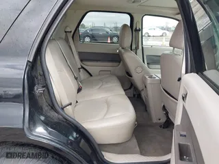 2009 Mercury Mariner Hybrid with VIN 4M2CU29319KJ18127, listed as a IAAI auction lot 41830660 with 273,438 mi miles. Bid and sale history available at carsss.com. Image 8.