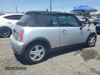 2006 MINI Convertible with VIN WMWRF33576TG16056, listed as a Copart auction lot 63127705 with 108,654 mi miles and Salvage title. Bid and sale history available at DreamBid. Image 3.