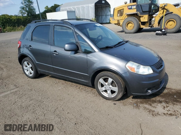 2010 Suzuki SX4 with VIN JS2YB5A24A6300249, listed as a Copart auction lot 71565394 with 291,886 mi miles and Salvage Title. Bid and sale history available at DreamBid. Image 4.