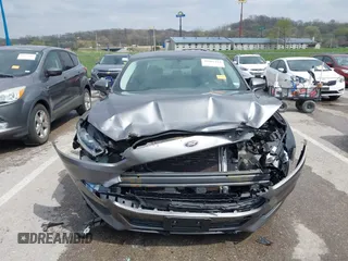 2014 Ford Fusion S with VIN 3FA6P0G70ER377725, listed as a IAAI auction lot 42007410 with 56,552 mi miles and . Bid and sale history available at carsss.com. Image 13.