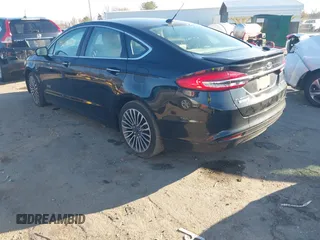2017 Ford Fusion Titanium with VIN 3FA6P0SU2HR309895, listed as a IAAI auction lot 40963527 with 80,761 mi miles and . Bid and sale history available at DreamBid. Image 3.