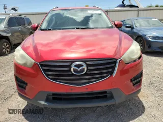 2016 Mazda CX-5 Sport с VIN JM3KE2BY4G0638102, выставлен на аукционе Copart как лот 56724445 с пробегом 189 235 миль миль и Списание • Salvage title. История ставок и продаж доступна на DreamBid. Изображение 5.