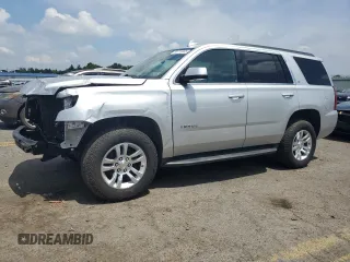 2020 Chevrolet Tahoe LT with VIN 1GNSKBKC1LR143522, listed as a Copart auction lot 64716865 with 74,952 mi miles and Salvage title. Bid and sale history available at DreamBid. Image 1.