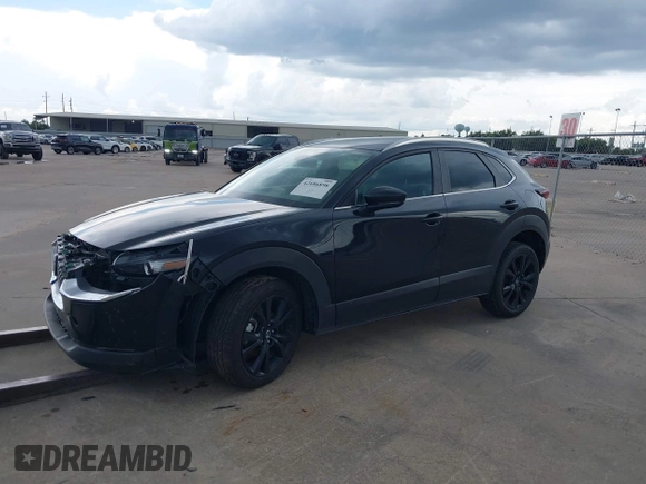 2024 Mazda CX-30 S Select Sport with VIN 3MVDMBBM3RM700797, listed as a IAAI auction lot 42686898 with 23,170 mi miles and . Bid and sale history available at DreamBid. Image 2.
