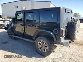 2013 Jeep Wrangler Unlimited Rubicon with VIN 1C4BJWFG2DL533839, listed as a Copart auction lot 88917985 with 112,673 mi miles and Salvage Title. Bid and sale history available at carsss.com. Image 2.