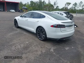2013 Tesla Model S Performance with VIN 5YJSA1DP9DFP04076, listed as a IAAI auction lot 42185465 with 179,640 mi miles and . Bid and sale history available at DreamBid. Image 3.