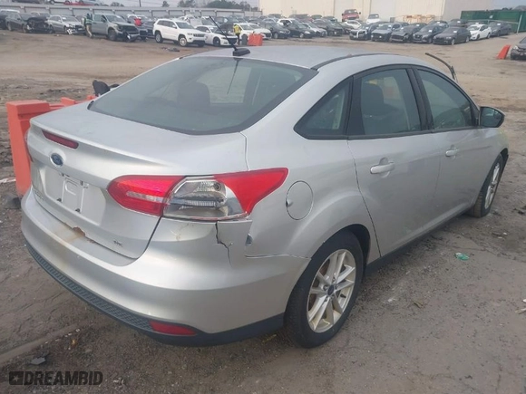 2015 Ford Focus SE with VIN 1FADP3F23FL276810, listed as a IAAI auction lot 41799093 with 127,048 mi miles. Bid and sale history available at carsss.com. Image 4.