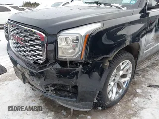 2020 GMC Yukon Denali with VIN 1GKS2CKJ5LR301216, listed as a IAAI auction lot 41439076 with 76,129 mi miles. Bid and sale history available at carsss.com. Image 6.