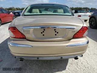 2004 Jaguar X-Type with VIN SAJEA51C34WE03194, listed as a Copart auction lot 78980144 with 51,164 mi miles and Clean Title. Bid and sale history available at carsss.com. Image 6.