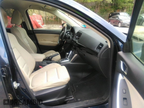 2014 Mazda CX-5 Touring z VIN JM3KE2CYXE0429149, wystawiony jako IAAI lot #42471772 z przebiegiem 222 440 mil mil oraz . Historia ofert i sprzedaży dostępna na DreamBid. Obrazek 5.