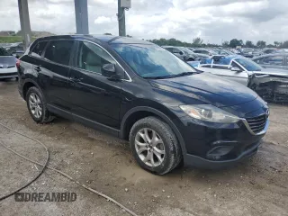 2015 Mazda CX-9 Sport with VIN JM3TB2BA5F0449957, listed as a Copart auction lot 52299825 with 105,017 mi miles and Salvage Title. Bid and sale history available at carsss.com. Image 4.