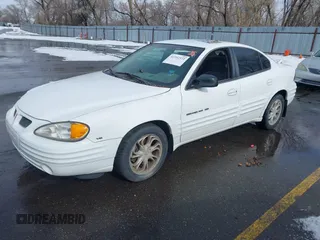 1999 Pontiac Grand Am SE1 with VIN 1G2NE52E3XM837376, listed as a IAAI auction lot 41552372 with 1 mi miles. Bid and sale history available at carsss.com. Image 2.