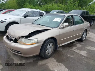 2002 Honda Accord EX z VIN 1HGCG16582A073438, wystawiony jako IAAI lot #42109802 z przebiegiem 172 379 mil mil oraz . Historia ofert i sprzedaży dostępna na DreamBid. Obrazek 2.