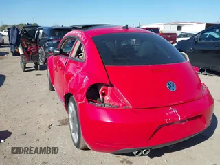 2013 Volkswagen Beetle 2.5L w/Sun/Sound/Nav with VIN 3VWJX7AT0DM673162, listed as a IAAI auction lot 41336320 with Not Provided miles and . Bid and sale history available at DreamBid. Image 3.