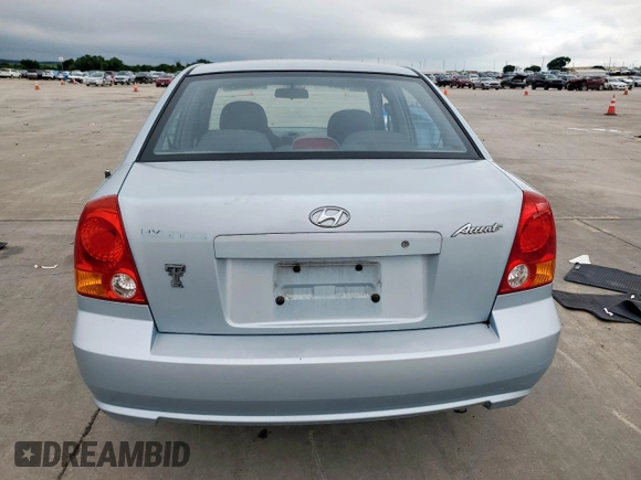 2003 Hyundai Accent GL z VIN KMHCG45C73U481294, wystawiony jako Copart lot #55958005 z przebiegiem 136 964 mil mil oraz Czysty tytuł • Clean title. Historia ofert i sprzedaży dostępna na DreamBid. Obrazek 6.