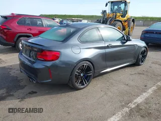 2018 BMW M2 with VIN WBS1J5C50JVE51869, listed as a IAAI auction lot 41814404 with 69,684 mi miles. Bid and sale history available at carsss.com. Image 4.