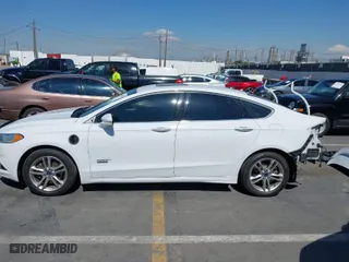 2016 Ford Fusion Energi Titanium with VIN 3FA6P0SU4GR320590, listed as a IAAI auction lot 41748132 with 360,161 mi miles. Bid and sale history available at carsss.com. Image 14.