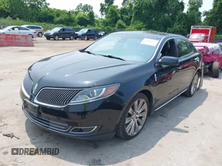 2013 Lincoln MKS EcoBoost with VIN 1LNHL9FT3DG602190, listed as a IAAI auction lot 42483472 with 63,238 mi miles and . Bid and sale history available at DreamBid. Image 2.
