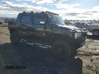 2005 Hummer H2 SUT with VIN 5GRGN22U55H112442, listed as a Copart auction lot 86158414 with 135,411 mi miles and Salvage Title. Bid and sale history available at carsss.com. Image 4.