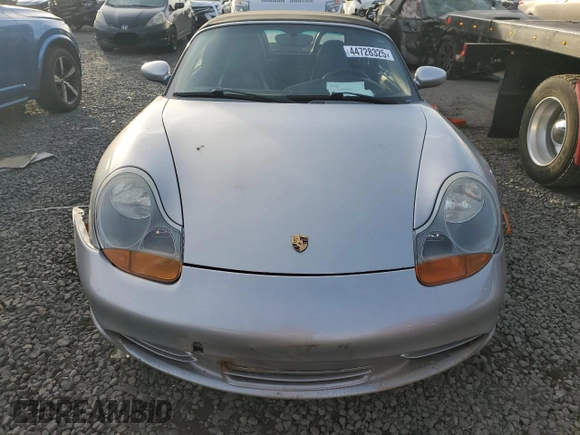 2000 Porsche Boxster z VIN WP0CA2980YU626179, wystawiony jako Copart lot #44728325 z przebiegiem 103 173 mil mil oraz Szkody całkowita. Historia ofert i sprzedaży dostępna na DreamBid. Obrazek 5.