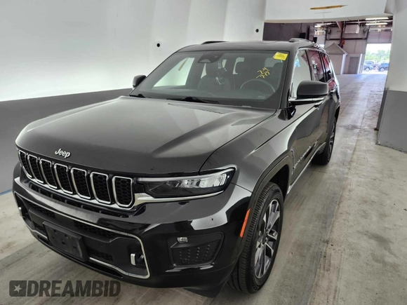 2021 Jeep Grand Cherokee Overland with VIN 1C4RJKDG7M8182214, listed as a IAAI auction lot 42796118 with 69,689 mi miles and . Bid and sale history available at DreamBid. Image 2.