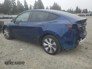 2022 Tesla Model Y Long Range z VIN 7SAYGDEE6NF429651, wystawiony jako Copart lot #57172355 z przebiegiem 19 499 mil mil oraz Szkoda całkowita • Salvage title. Historia ofert i sprzedaży dostępna na DreamBid. Obrazek 2.