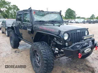 2015 Jeep Wrangler Unlimited Rubicon Hard Rock with VIN 1C4HJWFG0FL674700, listed as a IAAI auction lot 42511949 with 138,370 mi miles and . Bid and sale history available at DreamBid. Image 6.