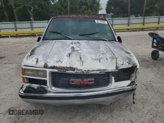 1997 GMC Suburban with VIN 1GKEC16R9VJ728883, listed as a Copart auction lot 52104265 with 246,816 mi miles and Salvage Title. Bid and sale history available at carsss.com. Image 5.