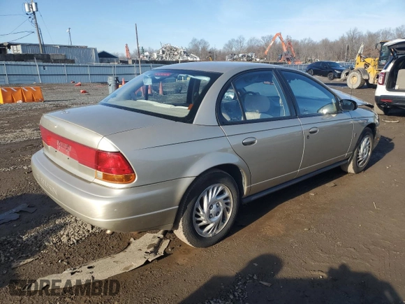 1999 Saturn SL z VIN 1G8ZK5270XZ212874, wystawiony jako Copart lot #85317464 z przebiegiem 153 477 mil mil oraz Szkoda całkowita • Salvage title. Historia ofert i sprzedaży dostępna na DreamBid. Obrazek 3.