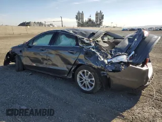 2020 Ford Fusion Plug-In Hybrid Titanium with VIN 3FA6P0SU0LR112720, listed as a Copart auction lot 87236964 with 47,657 mi miles and Salvage Title. Bid and sale history available at carsss.com. Image 2.