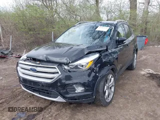 2019 Ford Escape Titanium with VIN 1FMCU9J91KUC42161, listed as a IAAI auction lot 41942122 with 100,677 mi miles and . Bid and sale history available at DreamBid. Image 2.