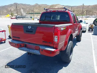 2015 Nissan Frontier SL with VIN 1N6AD0EV1FN711521, listed as a IAAI auction lot 42525352 with 203,114 mi miles and . Bid and sale history available at DreamBid. Image 4.