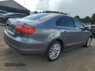 2014 Volkswagen Jetta TDI w/Premium with VIN 3VWLL7AJ4EM374570, listed as a Copart auction lot 63996195 with 186,497 mi miles and Salvage title. Bid and sale history available at DreamBid. Image 3.
