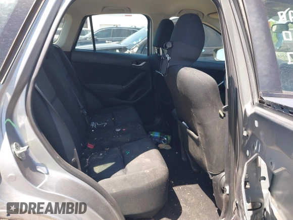 2014 Mazda CX-5 Sport with VIN JM3KE2BE7E0371203, listed as a IAAI auction lot 42243756 with 121,534 mi miles and . Bid and sale history available at DreamBid. Image 8.