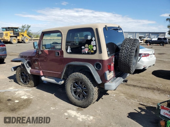 2002 Jeep Wrangler Sahara with VIN 1J4FA59S12P704608, listed as a Copart auction lot 69146504 with 125,920 mi miles and Salvage Title. Bid and sale history available at carsss.com. Image 2.