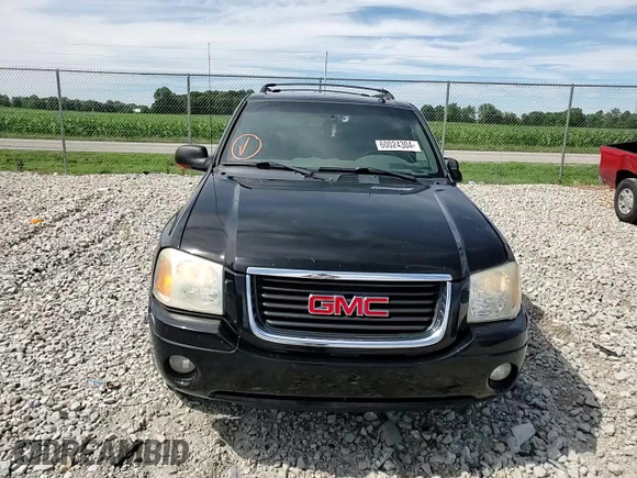 2004 GMC Envoy SLT with VIN 1GKDT13S042281050, listed as a Copart auction lot 60024304 with 267,205 mi miles and Salvage Title. Bid and sale history available at carsss.com. Image 12.