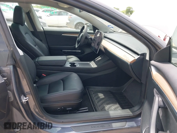 2023 Tesla Model 3 with VIN 5YJ3E1EA5PF565071, listed as a IAAI auction lot 42232719 with 15,389 mi miles and . Bid and sale history available at DreamBid. Image 5.