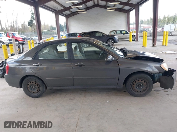 2004 Kia Spectra LX with VIN KNAFE121145031237, listed as a IAAI auction lot 41954550 with 133,744 mi miles. Bid and sale history available at carsss.com. Image 13.