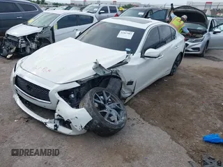 2015 Infiniti Q50 Premium z VIN JN1BV7APXFM352327, wystawiony jako IAAI lot #42367983 z przebiegiem 110 636 mil mil oraz . Historia ofert i sprzedaży dostępna na DreamBid. Obrazek 17.