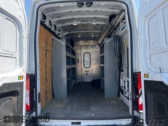 2020 Ford Transit Cargo with VIN 1FTBR3X85LKB54305, listed as a IAAI auction lot 42868187 with 82,829 mi miles and . Bid and sale history available at DreamBid. Image 12.