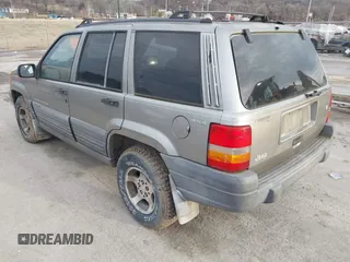 1997 Jeep Grand Cherokee Laredo with VIN 1J4GZ58S4VC745129, listed as a IAAI auction lot 41641005 with 1 mi miles. Bid and sale history available at carsss.com. Image 3.