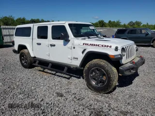 2023 Jeep Gladiator Rubicon with VIN 1C6JJTBG9PL546437, listed as a Copart auction lot 55516685 with 14,106 mi miles and Salvage title. Bid and sale history available at DreamBid. Image 4.