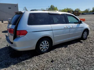 2010 Honda Odyssey EX-L with VIN 5FNRL3H76AB114542, listed as a Copart auction lot 54785425 with 104,239 mi miles and Salvage Title. Bid and sale history available at DreamBid. Image 3.